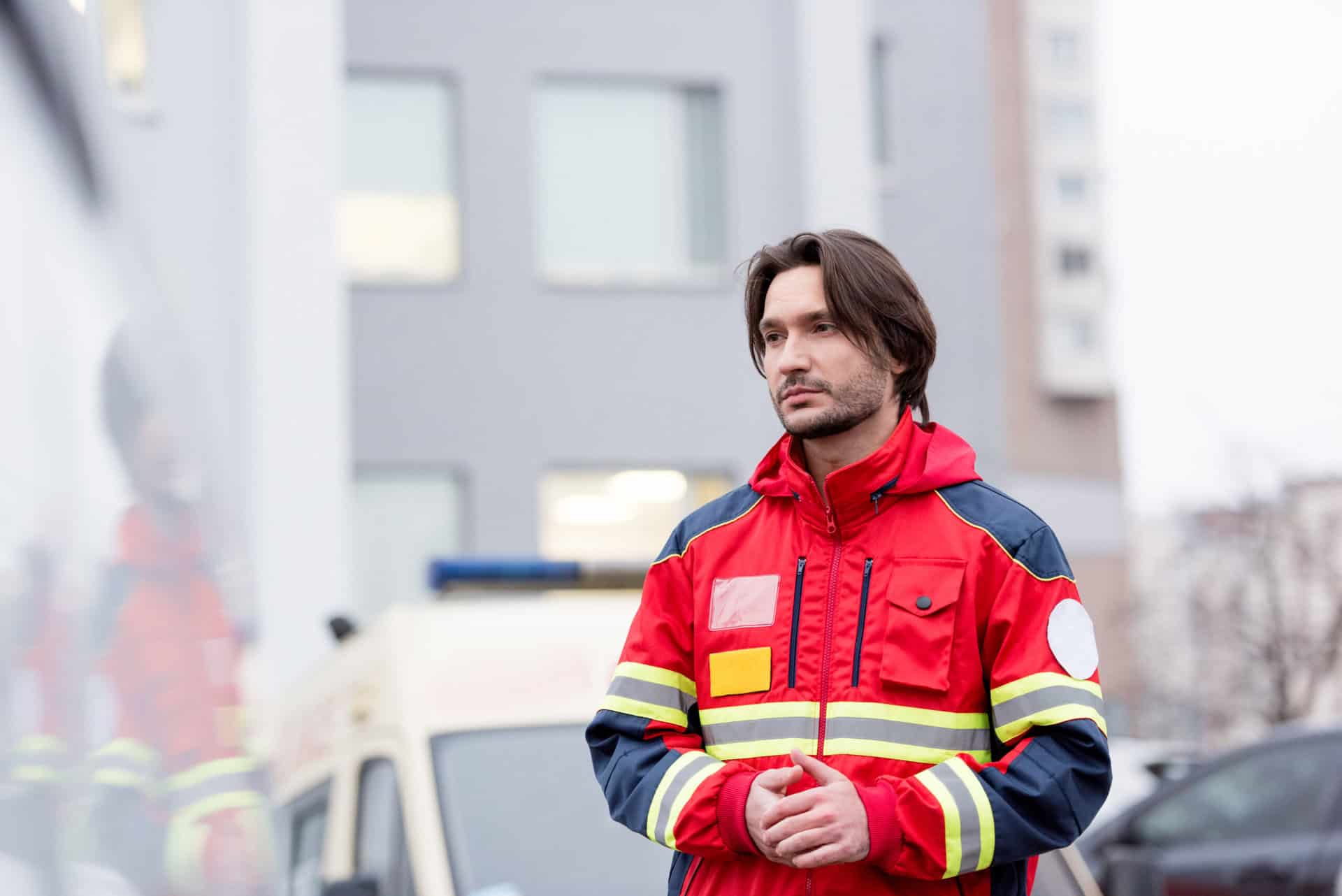 A paramedic practicing ADHD stress management techniques, using mindfulness to stay calm and focused during an emergency situation.